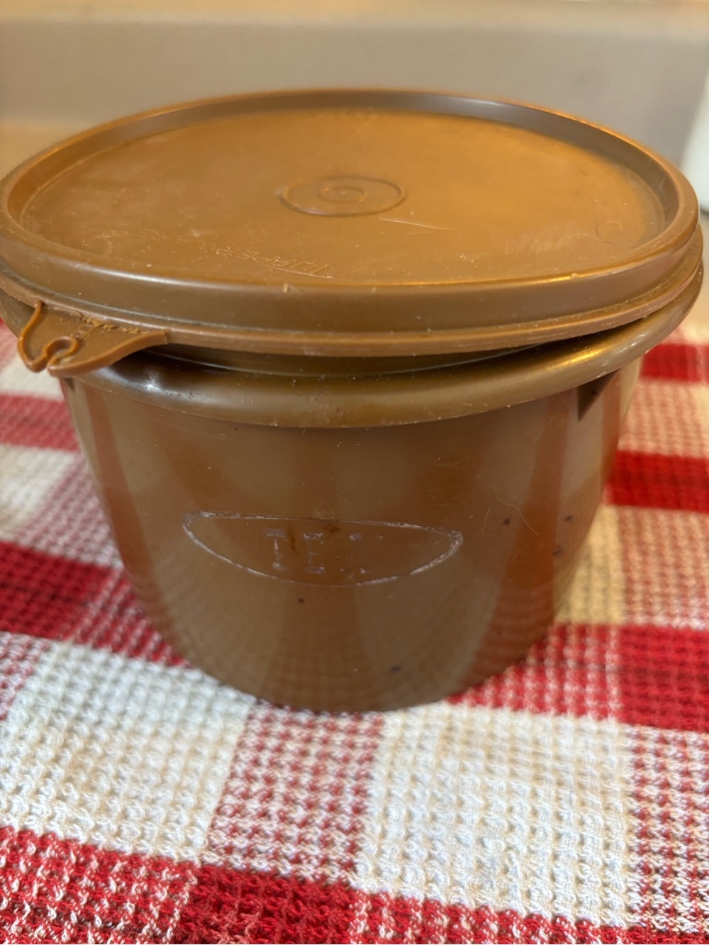 Vintage brown Tupperware tea storage canister